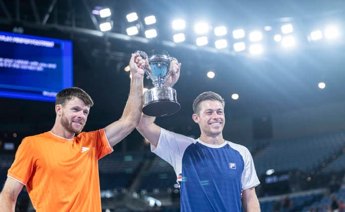 (260131) -- MELBOURNE, Jan. 31, 2026 -- Christian Harrison (L) Neal Skupski hold the trophy during the awarding ceremony for the men s doubles final match between Jason Kubler Marc Polmans (Australia) and Christian Harrison (the United States) Neal Skupski (Britain) at the Australian Open tennis tournament in Melbourne, Australia, Jan. 31, 2026. (Photo by Xinhua) (SP)AUSTRALIA-MELBOURNE-TENNIS-AUSTRALIAN OPEN-MEN S DOUBLES-FINAL HuxJingchen 