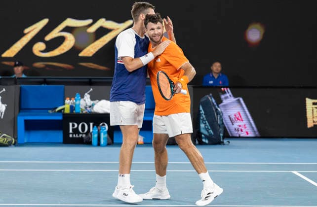 (260131) -- MELBOURNE, Jan. 31, 2026 -- Christian Harrison (R) Neal Skupski celebrate winning the men s doubles final match between Jason Kubler Marc Polmans (Australia) and Christian Harrison (the United States) Neal Skupski (Britain) at the Australian Open tennis tournament in Melbourne, Australia, Jan. 31, 2026. (Photo by Xinhua) (SP)AUSTRALIA-MELBOURNE-TENNIS-AUSTRALIAN OPEN-MEN S DOUBLES-FINAL HuxJingchen 
