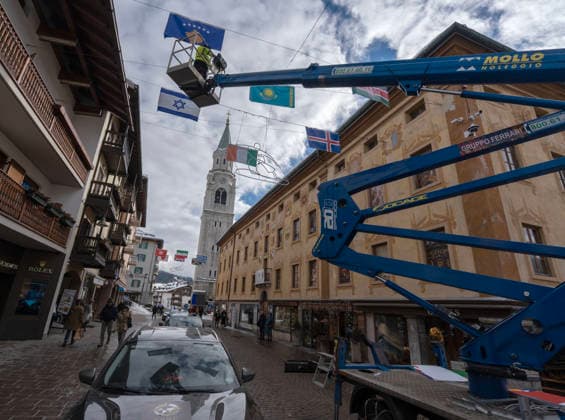 January 30, 2026, Cortina D ampezzo, Belluno, Italy: International flags are hung all ng the walking street with only a few days until the start of the 2026 Milano Cortina Winter Olympics. A buzz of frantic last minute construction, preparations and excitement is noticeable in the venues and village of Cortina dÃ¢â‚¬â ¢Ampezzo Thursday, January 30, 2026. Cortina D ampezzo Italy - ZUMAa35_ 20260130_oly_a35_002 Copyright: xDanxAndersonx