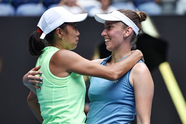 Zhang Shuai yellow , CHN, and Elise Mertens blue , BEL, during womens doubles finals at 2026 Australian Open in Melbourne, 31 01 2026