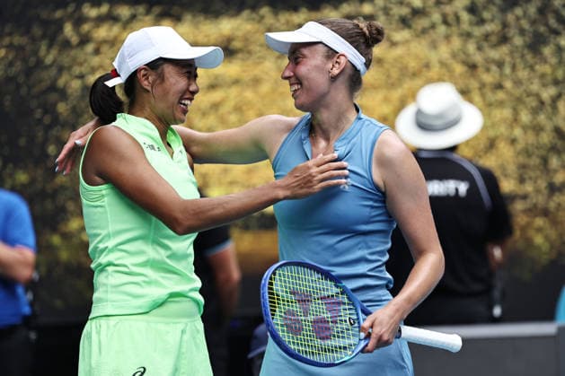 Zhang Shuai yellow , CHN, and Elise Mertens blue , BEL, during womens doubles finals at 2026 Australian Open in Melbourne, 31 01 2026