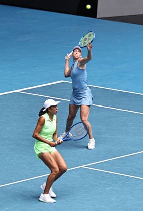 Zhang Shuai yellow , CHN, and Elise Mertens blue , BEL, during womens doubles finals at 2026 Australian Open in Melbourne, 31 01 2026