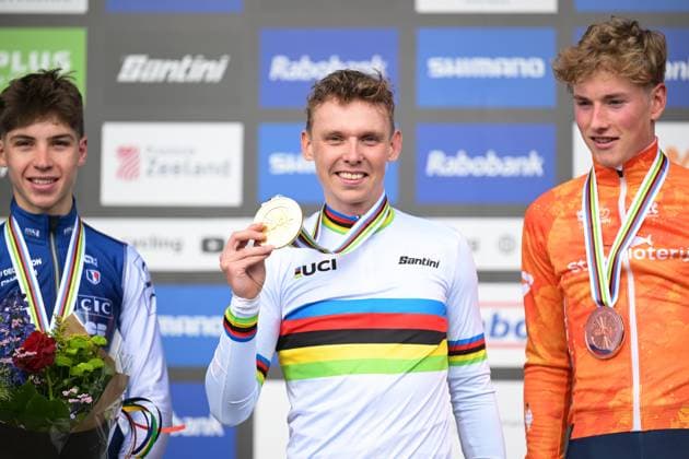 French Aubin Sparfel, Belgian Aaron Dockx and Dutch Keije Solen celebrate on the podium after the U23 men race at the UCI Cyclocross World Championships, on Saturday 31 January 2026, in Hulst, The Netherlands. DAVIDxPINTENS  x160035478x