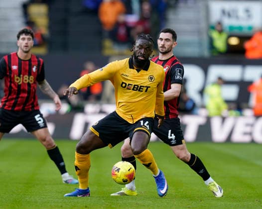 Wolverhampton, England, 31st January 2026. Tolu Arokodare of Wolverhampton Wanderers and Lewis Cook of Bournemouth during the Wolverhampton Wanderers vs AFC Bournemouth Premier League match at Molineux, Wolverhampton. Picture credit should read: Andrew Yates Sportimage EDITORIAL USE ONLY. No use with unauthorised audio, video, data, fixture lists, club league logos or live services. Online in-match use limited to 120 images, no video emulation. No use in betting, games or single club league player publications. SPI_022_AY_Wolves_Bmouth SPI-4493-0022