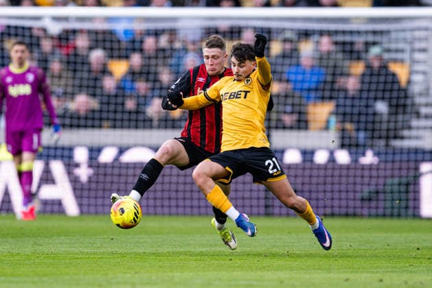 31st January 2026; Molineux Stadium, Wolverhampton, West Midlands, England; Premier League Football, Wolverhampton Wanderers versus Bournemouth; Rodrigo Gomes of Wolverhampton Wanderers holds off Adrien Truffert of AFC Bournemouth  GodfreyxPitt Content restricted for UK based newspaper