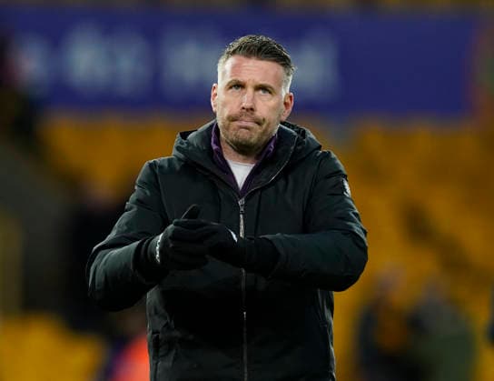 Wolverhampton, England, 31st January 2026. Dejected Rob Edwards manager of Wolverhampton Wanderers claps the fans during the Wolverhampton Wanderers vs AFC Bournemouth Premier League match at Molineux, Wolverhampton. Picture credit should read: Andrew Yates Sportimage EDITORIAL USE ONLY. No use with unauthorised audio, video, data, fixture lists, club league logos or live services. Online in-match use limited to 120 images, no video emulation. No use in betting, games or single club league player publications. SPI_057_AY_Wolves_Bmouth SPI-4493-0055