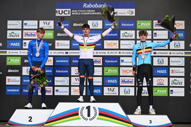 L-R, silver medalist Italian Filippo Grigolini, winner Dutch Delano Heeren wearing the world champion jersey and bronze medalist Belgian Giel Lejeune celebrate on the podium of the junior men race at UCI Cyclocross World Championships, on Sunday 01 February 2026, in Hulst, The Netherlands. DAVIDxPINTENS  x160221137x