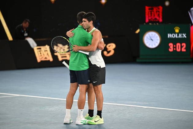 2026 Australian Open - Day 15 MELBOURNE, AUSTRALIA - FEBRUARY 01: Spain s Carlos Alcaraz speaks with Serbia s Novak Djokovic after victory during their men s singles final match on day fifteen of the Australian Open tennis tournament in Melbourne on February 01, 2026. Mark Avellino Anadolu Melbourne Australia. Editorial use only. Please get in touch for any other usage.  Copyright: x2026xAnadoluxMarkxAvellinox