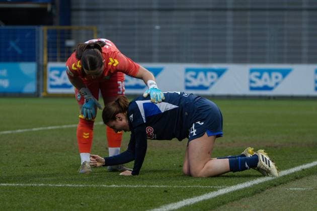 Mariella El Sherif 39 SV Werder Bremen comforts Feli Delacauw 24 TSG Hoffenheim down after injury Injury and consolation Copyright: xspeedshotx