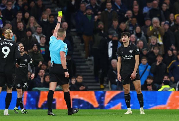 London, England, 1st February 2026. Abdukodir Khusanov of Manchester City is shown a yellow card during the Tottenham Hotspur vs Manchester City Premier League match at the Tottenham Hotspur Stadium, London. Picture credit should read: Paul Terry Sportimage EDITORIAL USE ONLY. No use with unauthorised audio, video, data, fixture lists, club league logos or live services. Online in-match use limited to 120 images, no video emulation. No use in betting, games or single club league player publications. SPI_028_PT_Tottenham_Man_City SPI-4504-0028