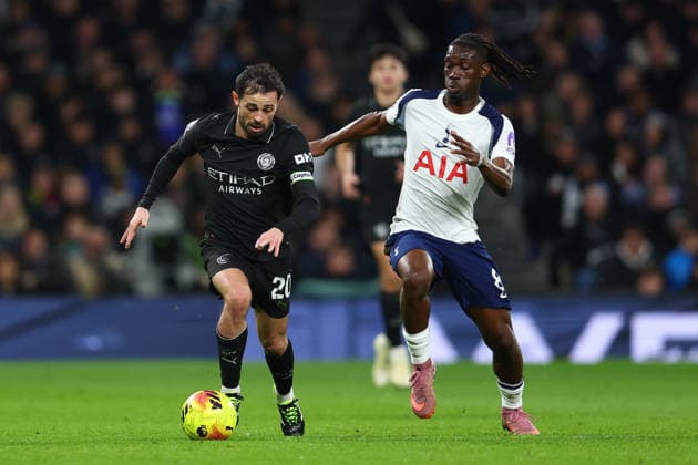 London, England, 1st February 2026. Bernardo Silva of Manchester City and Yves Bissouma of Tottenham Hotspur challenge for the ball during the Tottenham Hotspur vs Manchester City Premier League match at the Tottenham Hotspur Stadium, London. Picture credit should read: Paul Terry Sportimage EDITORIAL USE ONLY. No use with unauthorised audio, video, data, fixture lists, club league logos or live services. Online in-match use limited to 120 images, no video emulation. No use in betting, games or single club league player publications. SPI_031_PT_Tottenham_Man_City SPI-4504-0031