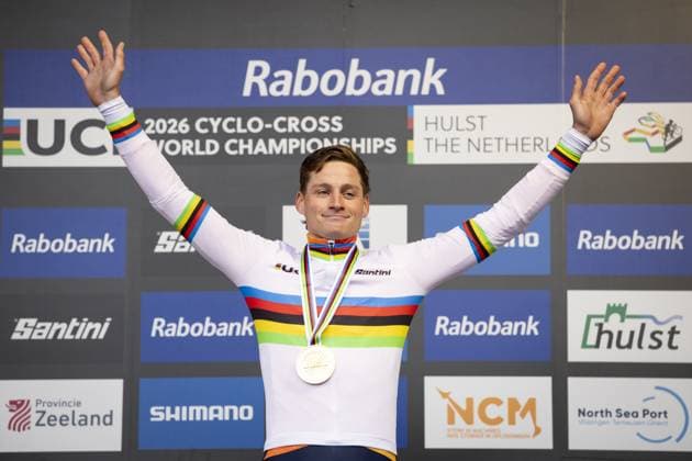 HULST - Cyclist Mathieu van der Poel celebrates his victory on the podium at the Cyclocross World Championships in Hulst, Zeeland. IRIS VAN DEN BROEK ANP xVIxANPxSportx xxANPxIVx 549345200 originalFilename: 549345200.jpg