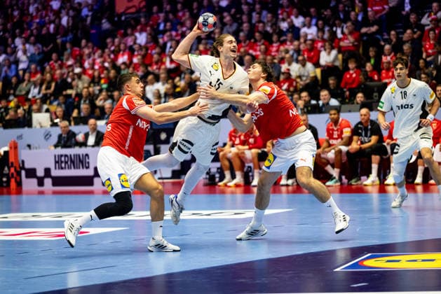 HERNING, DENMARK - FEBRUARY 1: Juri Knorr (Germany, 15) against Mads Hoxer Hangaard (Denmark, 38) and Niclas Kirkelokke (Denmark, 03) during the EHF EURO 2026 Final match between Denmark vs Germany at Jyske Bank Boxen Arena on February 1, 2026 in Herning, Denmark. Midtjylland Denmark Copyright: xMarioxM.xKobergx