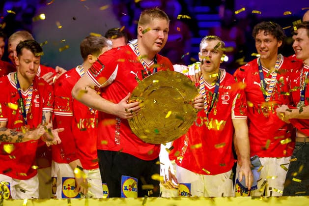 01 02 2026, Handball, Men s EHF EURO 2026, Germany Denmark, Jyske Bank Boxen in Herning, Final Denmark is European Champion The team celebrates the victory cheering on the pitch Emil Nielsen Denmark 12 cheering with the trophy championship cup in his hand at the award ceremony Denmark