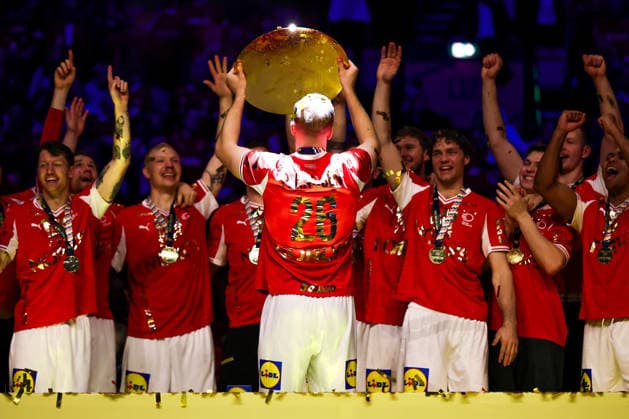 01 02 2026, Handball, Men s EHF EURO 2026, Germany Denmark, Jyske Bank Boxing in Herning, Final Denmark is European Champion The team celebrates the victory cheering on the pitch Johan a Plogv Hansen Denmark 26 cheering with the trophy championship cup in his hand at the award ceremony Denmark