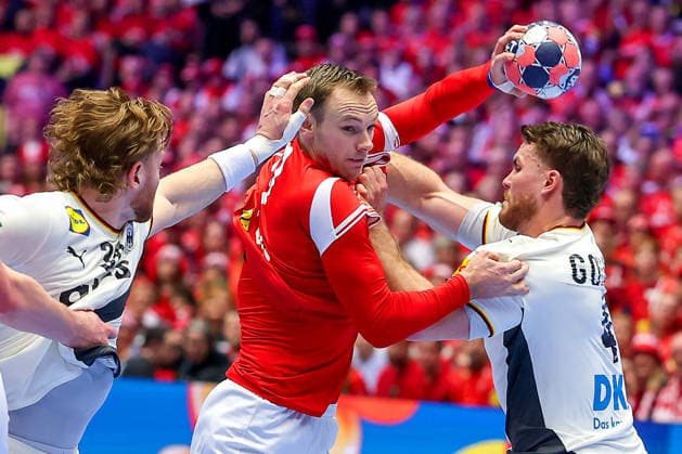 01 02 2026, Handball, Men s EHF EURO 2026, Germany Denmark, Jyske Bank Boxing in Herning, Final Tom Kiesler Germany 30 Johannes Golla Germany 04 defend against Mathias Gidsel Denmark 19 Denmark