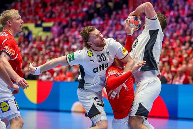 01 02 2026, Handball, Men s EHF EURO 2026, Germany Denmark, Jyske Bank Boxing in Herning, Final Tom Kiesler Germany 30 Johannes Golla Germany 04 defend against Mathias Gidsel Denmark 19 Denmark