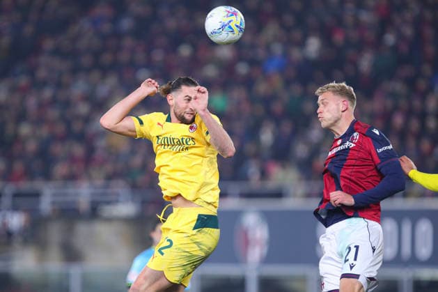 Adrien Rabiot of AC Milan and Jens Odgaard of Bologna FC compete for a header during the serie A match between Bologna FC and AC Milan at Renato dall™Ara stadium in Bologna (Italy), February 3, 2026. massimilianoxcarnabuci