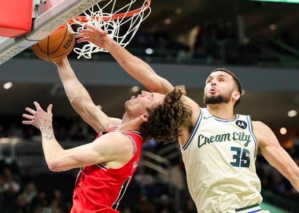 (260204) -- MILWAUKEE, Feb. 4, 2026 -- Chicago Bulls Matas Buzelis (L) drives to the basket against Milwaukee Bucks Pete Nance during the 2025-2026 NBA, Basketball Herren, USA regular season basketball game between Milwaukee Bucks and Chicago Bulls in Milwaukee, the United States, on Feb. 3, 2026. (Photo by Xinhua) (SP)U.S.-MILWAUKEE-BASKETBALL-NBA-BUCKS VS BULLS JoelxLerner 