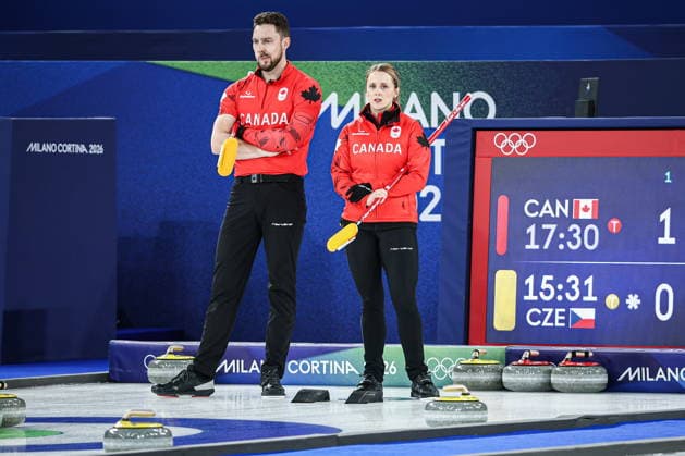 ITALY, CORTINA D AMPEZZO - FEBRUARY 4, 2026: Curlers Brett Gallant (L) and Jocelyn Peterman of Canada are seen in the Mixed Doubles Round Robin Session 1 curling event during the 2026 Winter Olympic Games, Olympische Spiele, Olympia, OS at the Cortina Curling Olympic Stadium. Mikhail Tereshchenko TASS  88209368