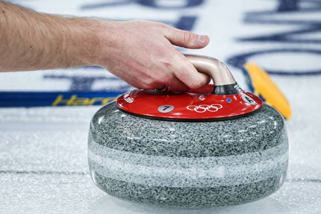 ITALY, CORTINA D AMPEZZO - FEBRUARY 4, 2026: Curler Rasmus Wrana of Sweden is in action in the Mixed Doubles Round Robin Session 1 curling event during the 2026 Winter Olympic Games, Olympische Spiele, Olympia, OS at the Cortina Curling Olympic Stadium. Mikhail Tereshchenko TASS  88209422
