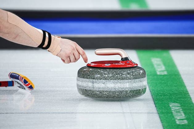 ITALY, CORTINA D AMPEZZO - FEBRUARY 4, 2026: Curler Bruce Mouat of Great Britain is in action in the Mixed Doubles Round Robin Session 1 curling event during the 2026 Winter Olympic Games, Olympische Spiele, Olympia, OS at the Cortina Curling Olympic Stadium. Mikhail Tereshchenko TASS  88210992