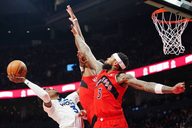 February 4, 2026, Toronto, On, CANADA: Minnesota Timberwolves Jaden McDaniels (3) is fouled by Toronto Raptors Collin Murray-Boyles (centre back) as Brandon Ingram (3) defends during first half NBA, Basketball Herren, USA basketball action in Toronto on Wednesday, Feb. 4, 2026. Canada News - February 4, 2026  - ZUMAc35_ 20260204_zaf_c35_104 Copyright: xFrankxGunnx