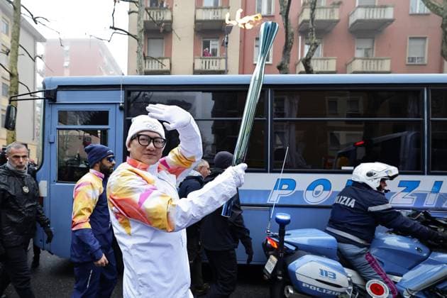 Milan Cortina Olympics: Torch relay A runner carries the Olympic flame during the Milan Cortina Olympics torch relay in Milan on Feb. 5, 2026.  A14AA0005246532P