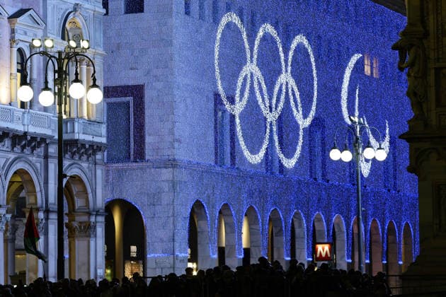Milan Cortina Olympics: Torch relay Images of the Olympic rings and the Three Agitos Paralympic symbol are projected on a building near Piazza Duomo during the Milan Cortina Olympics torch relay on Feb. 5, 2026, the eve of the opening of the games.  A14AA0005247962P
