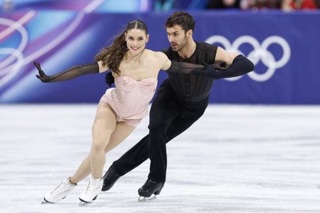 Milan Cortina Olympics: Figure skating, Eiskunstlauf French ice dancers Laurence Fournier Beaudry (L) and Guillaume Cizeron perform their rhythm dance during the figure skating team event at the Milan Cortina Olympics at Milano Ice Skating Arena in Milan on Feb. 6, 2026.  A14AA0005248714P