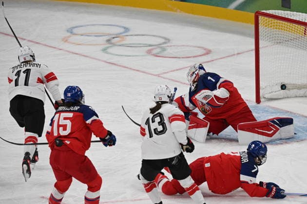 Laura Zimmermann (SUI), left, scores during women s Ice hockey, Eishockey match of Group A: Czechia vs Switzerland, at the Milano Cortina 2026 Winter Olympic Games, Olympische Spiele, Olympia, OS in Milan, Italy, on February 6, 2026. On the photo are seen (R-L) goalkeeper Michaela Hesova (CZE), Aneta Tejralova (CZE), Ivana Wey (SUI) and Andrea Trnkova (CZE). (CTKxPhoto MichalxKamaryt) CTKPhotoP2026020606485  CTKPhotoP2026020606485