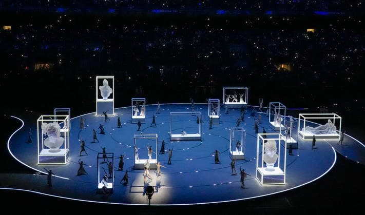 Dancers perform during the Opening Ceremony of the Milano Cortina 2026 Olympic Games, Olympische Spiele, Olympia, OS at San Siro Stadium in Milan, Italy, on Friday, February 6, 2026. More than 2,900 athletes from 92 national Olympic committees will compete, with the United States having the largest presence with more than 230 athletes.  OLY20260206105 RICHARDxELLIS