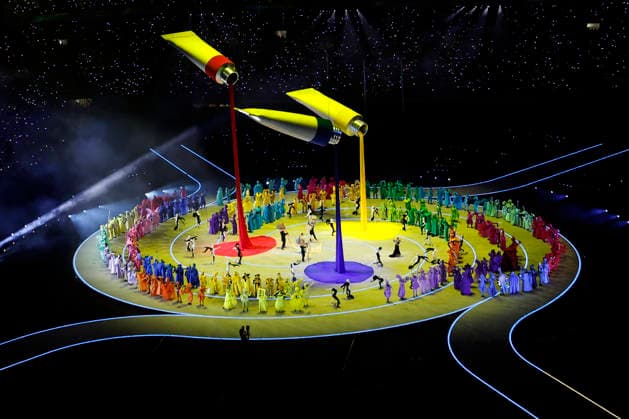Paint tubes hang over dancers performing during the Opening Ceremony of the Milano Cortina 2026 Olympic Games, Olympische Spiele, Olympia, OS at San Siro Stadium in Milan, Italy, on Friday, February 6, 2026. More than 2,900 athletes from 92 national Olympic committees will compete, with the United States having the largest presence with more than 230 athletes.  OLY20260206308 AARONxJOSEFCZYK