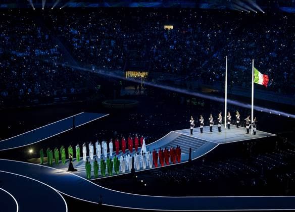MILAN - The Italian flag is raised during the opening ceremony of the Winter Olympics at the San Siro Stadium. ROBIN VAN LONKHUIJSEN ANP xVIxANPxSportx xxANPxIVx 549840853 originalFilename: 549840853.jpg