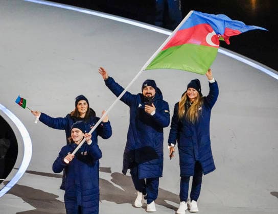 The team from Azerbaigian participates in the parade of atheletes during the Opening Ceremony of the Milano Cortina 2026 Olympic Games, Olympische Spiele, Olympia, OS at San Siro Stadium in Milan, Italy, on Friday, February 6, 2026. More than 2,900 athletes from 92 national Olympic committees will compete, with the United States having the largest presence with more than 230 athletes.  OLY20260206124 RICHARDxELLIS