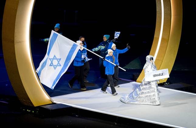 MILAN The Israeli flag is carried during the opening ceremony of the Winter Olympics at the San Siro Stadium. ROBIN VAN LONKHUIJSEN ANP xVIxANPxSportx xxANPxIVx 549845662 originalFilename: 549845662.jpg