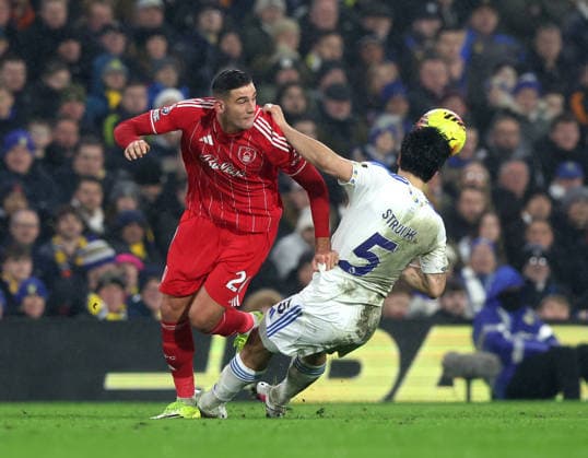 Leeds, England, 6th February 2026. Lorenzo Lucca of Nottingham Forest tussles with Pascal Struijk of Leeds United during the Leeds United vs Nottingham Forest Premier League match at Elland Road, Leeds. Picture credit should read: Nigel Roddis Sportimage EDITORIAL USE ONLY. No use with unauthorised audio, video, data, fixture lists, club league logos or live services. Online in-match use limited to 120 images, no video emulation. No use in betting, games or single club league player publications. SPI_044_NR_LEED_NOTT SPI-4510-0044