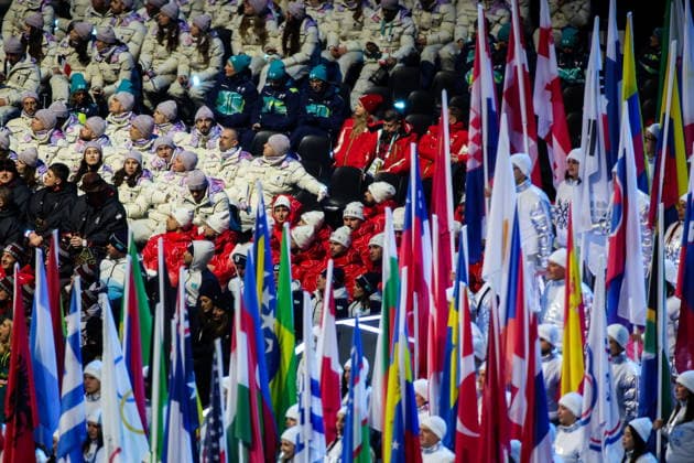 ITALY, MILAN - FEBRUARY 6, 2026: National flags emerge during a ceremony to open the 2026 Winter Olympic Games, Olympische Spiele, Olympia, OS at San Siro Stadium. Peter Kovalev TASS  88305524