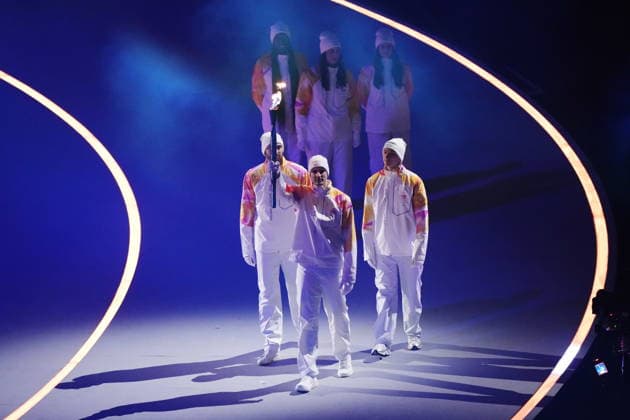 February 6, 2026, Milan, ITALY: The Olympic flame is carried in during the opening ceremony at the Milan Cortina Winter Olympics, in Milan, on Friday, February 6, 2026. Canada News - February 6, 2026  - ZUMAc35_ 20260206_zaf_c35_230 Copyright: xNathanxDenettex