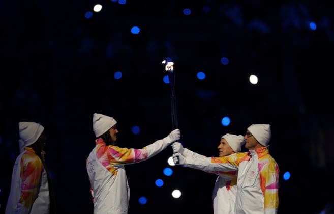 (260207) -- MILAN, Feb. 7, 2026 -- Torchbearers pass the flame during the opening ceremony of the Milan-Cortina 2026 Olympic Winter games, Winterspiele,Spiele, Summer games at the San Siro Olympic Stadium in Milan, Italy, Feb. 6, 2026. ) (MICO2026)ITALY-MILAN-CORTINA 2026-OLYMPIC WINTER GAMES-OPENING CEREMONY LixMing 
