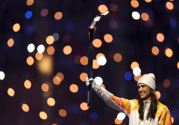 (260207) -- MILAN, Feb. 7, 2026 -- A torchbearer carries the Olympic torch during the opening ceremony of the Milan-Cortina 2026 Olympic Winter games, Winterspiele,Spiele, Summer games at the San Siro Olympic Stadium in Milan, Italy, Feb. 6, 2026. ) (MICO2026)ITALY-MILAN-CORTINA 2026-OLYMPIC WINTER GAMES-OPENING CEREMONY LixMing 