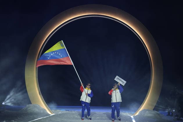 (260207) -- PREDAZZO, Feb. 7, 2026 -- The delegation of Venezuela parades into the Predazzo Ski jumping, Skispringen, Ski, nordisch Stadium during the opening ceremony of the Milan-Cortina 2026 Olympic Winter games, Winterspiele,Spiele, Summer games in Predazzo, Italy, Feb. 6, 2026. ) (MICO2026)ITALY-MILAN-CORTINA 2026-OLYMPIC WINTER GAMES-OPENING CEREMONY HuangxWei 