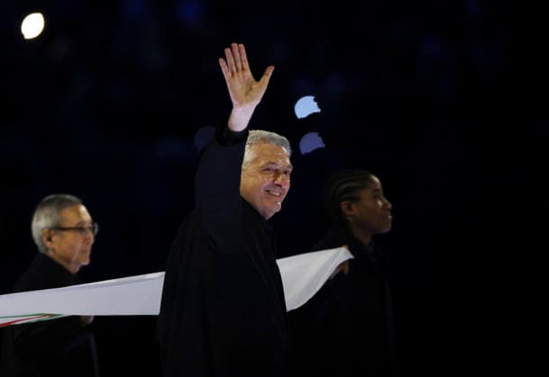 (260207) -- MILAN, Feb. 7, 2026 -- Flag bearer Filippo Grandi carries the Olympic flag into the San Siro Olympic Stadium during the opening ceremony of the Milan-Cortina 2026 Olympic Winter games, Winterspiele,Spiele, Summer games at the San Siro Olympic Stadium in Milan, Italy, Feb. 6, 2026. ) (MICO2026)ITALY-MILAN-CORTINA 2026-OLYMPIC WINTER GAMES-OPENING CEREMONY LixJing 