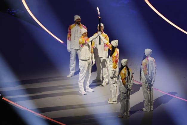 (260207) -- MILAN, Feb. 7, 2026 -- Torchbearers pass the flame during the opening ceremony of the Milan-Cortina 2026 Olympic Winter games, Winterspiele,Spiele, Summer games at the San Siro Olympic Stadium in Milan, Italy, Feb. 6, 2026. ) (MICO2026)ITALY-MILAN-CORTINA 2026-OLYMPIC WINTER GAMES-OPENING CEREMONY WangxKaiyan 