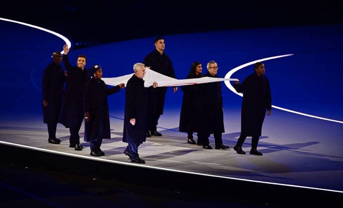 (260207) -- MILAN, Feb. 7, 2026 -- Flag bearers carry the Olympic flag into the San Siro Olympic Stadium during the opening ceremony of the Milan-Cortina 2026 Olympic Winter games, Winterspiele,Spiele, Summer games at the San Siro Olympic Stadium in Milan, Italy, Feb. 6, 2026. ) (MICO2026)ITALY-MILAN-CORTINA 2026-OLYMPIC WINTER GAMES-OPENING CEREMONY TaoxXiyi 