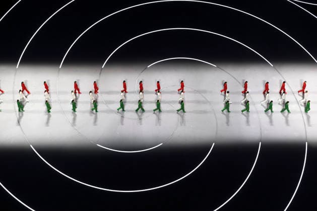 260206 -- MILAN, Feb. 6, 2026 -- Three groups of models walk the runway wearing creations designed by Giorgio Armani during the opening ceremony of the Milan-Cortina 2026 Olympic Winter games, Winterspiele,Spiele, Summer games at the San Siro Olympic Stadium in Milan, Italy, Feb. 6, 2026. MICO2026ITALY-MILAN-CORTINA 2026-OLYMPIC WINTER GAMES-OPENING CEREMONY ChenxYichen  (MICO2026)ITALY-MILAN-CORTINA 2026-OLYMPIC WINTER GAMES-OPENING CEREMONY IMAGO ChenxYichen  imago images 0847010965