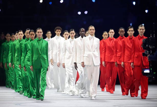 260206 -- MILAN, Feb. 6, 2026 -- Three groups of models walk the runway wearing creations designed by Giorgio Armani during the opening ceremony of the Milan-Cortina 2026 Olympic Winter games, Winterspiele,Spiele, Summer games at the San Siro Olympic Stadium in Milan, Italy, Feb. 6, 2026. MICO2026ITALY-MILAN-CORTINA 2026-OLYMPIC WINTER GAMES-OPENING CEREMONY LixMing  (MICO2026)ITALY-MILAN-CORTINA 2026-OLYMPIC WINTER GAMES-OPENING CEREMONY IMAGO LixMing  imago images 0847013128