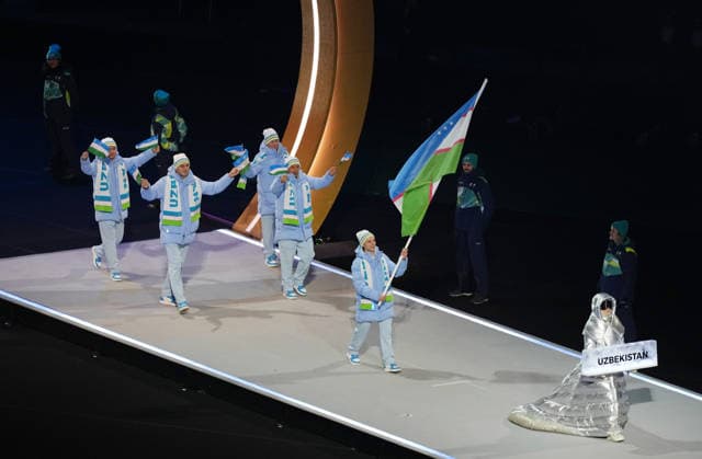 (260207) -- MILAN, Feb. 7, 2026 -- The delegation of Uzbekistan parades into the San Siro Olympic Stadium during the opening ceremony of the Milan-Cortina 2026 Olympic Winter games, Winterspiele,Spiele, Summer games in Milan, Italy, Feb. 6, 2026. ) (MICO2026)ITALY-MILAN-CORTINA 2026-OLYMPIC WINTER GAMES-OPENING CEREMONY XuexYuge 