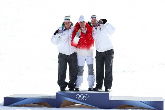 Franjo von Allmen (SUI) , Giovanni Franzoni (ITA) and Dominik Paris (ITA) show the medals over the podium after winning the race at the end of the Olympic Winter games, Winterspiele,Spiele, Summer games Milano-Cortina 2026, Alpine Skiing Men s Downhill on February 07, 2026 at Stelvio Ski Centre in Bormio, Italy  Copyright: xSergioxBisi IPAxSportx xipa-agency.netx xx IPA_71065385 IPA_Agency_IPA71065385