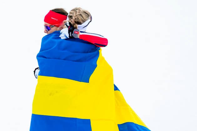 Winter Olympics in Milan Cortina 2026 Val di Fiemme, Italy 20260207. Frida Karlsson from Sweden and Heidi Weng from Norway cheer during the women s cross-country 20 km Skiathlon at Lago di Tesero during the Milan Cortina 2026 Winter Olympics. Photo: Lise Aserud NTB Val di Fiemme Italy EDITORIAL USE ONLY. RESTRICTED USE FOR BETTING COMPANIES Ref:_SPO7yV9QlrEV4E.jpg *** Winter Olympics in Milan Cortina 2026 Val di Fiemme, Italy 20260207 Frida Karlsson from Sweden and Heidi Weng from Norway cheer during the women s cross country 20 km Skiathlon at Lago di Tesero during the Milan Cortina 2026 Winter Olympics Photo Lise Aserud NTB Val di Fiemme Italy EDITORIAL USE ONLY RESTRICTED USE FOR BETTING COMPANIES  Copyright: xLisexAserudx xNTBx